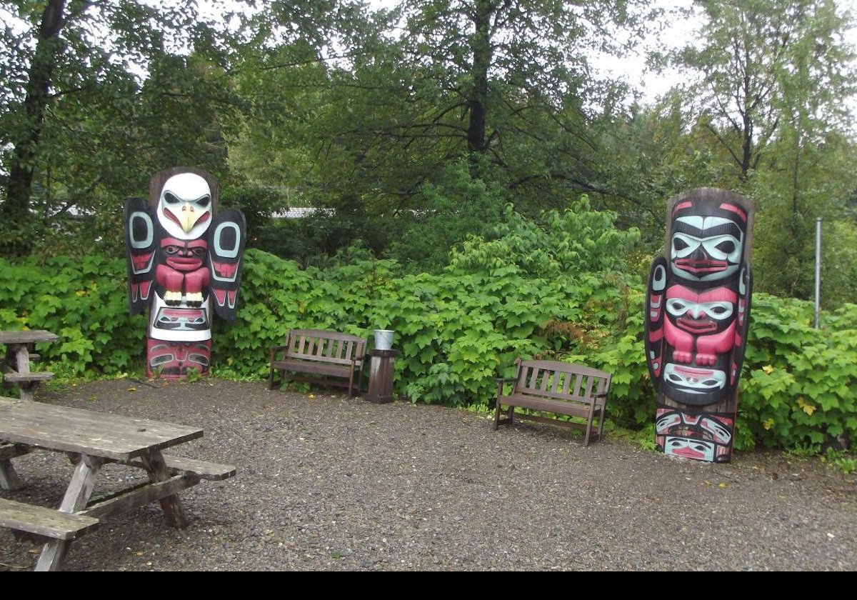 Heading north from Icy Strait Point, in the opposite direction to Hoonah, we found these two totems in a picnic area.