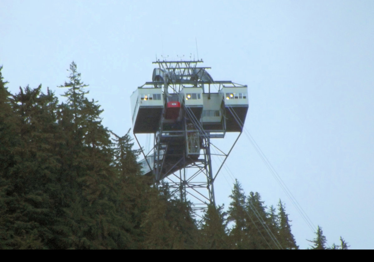 The Mount Roberts aerial tramway located just south of downtown Juneau has operated since 1996. Mount Roberts is 1,164 m (3,819 feet) tall, and the tram takes 6 minutes to ascend or descend. The two cabins are connected by a 2.4 km (7,875 foot) cable 35mm (1.4 ins) thick.  Just ONE cable?