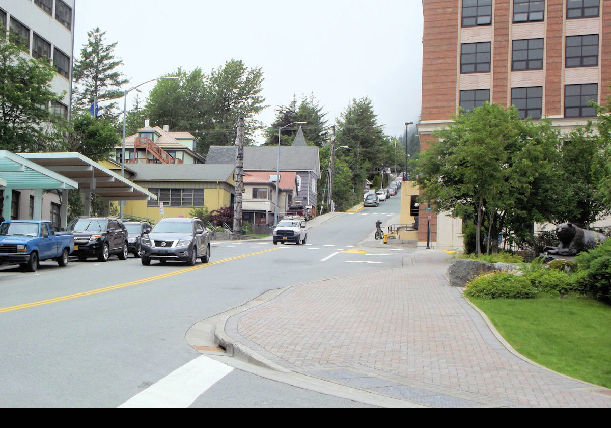 Heading up Main Street towards the Juneau-Douglas City Museum on the left and the "Windfall Fisherman" sculpture on the right.