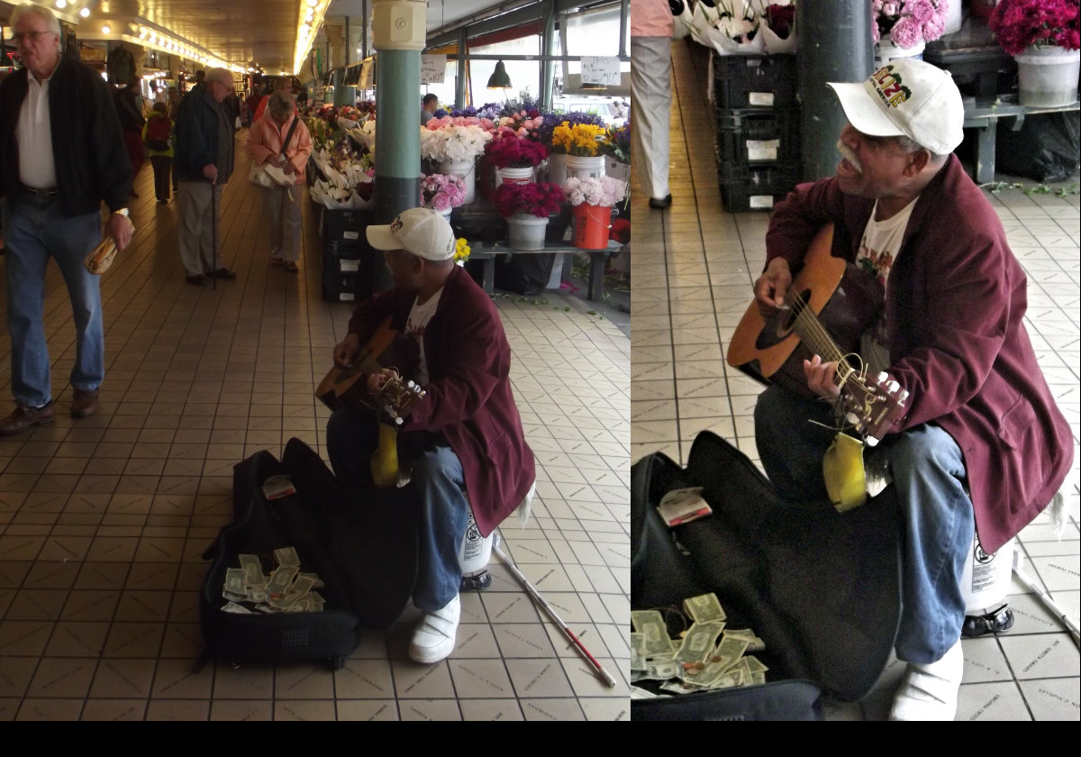 Flowers and a busker in Pike Place Market.