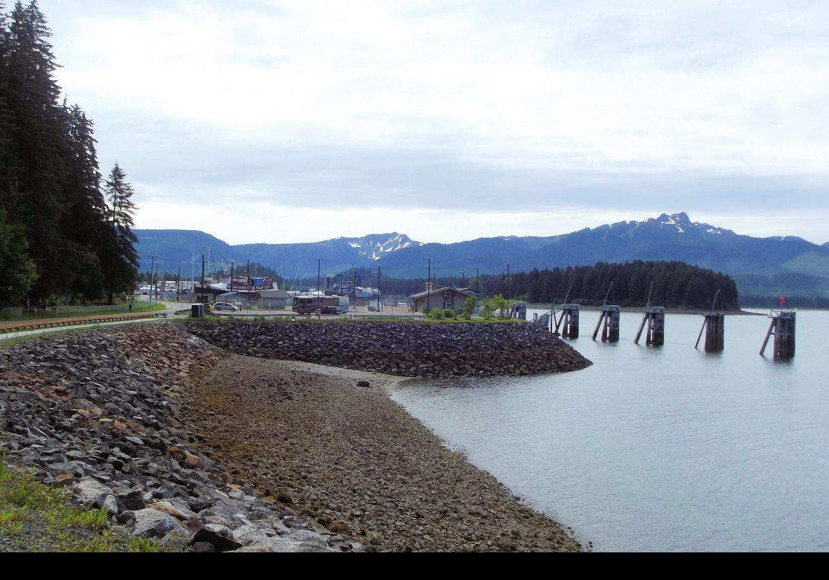 On the outskirts of the city.  It has a year round population of about 860, over 60% of whom are Tlingit people.  
