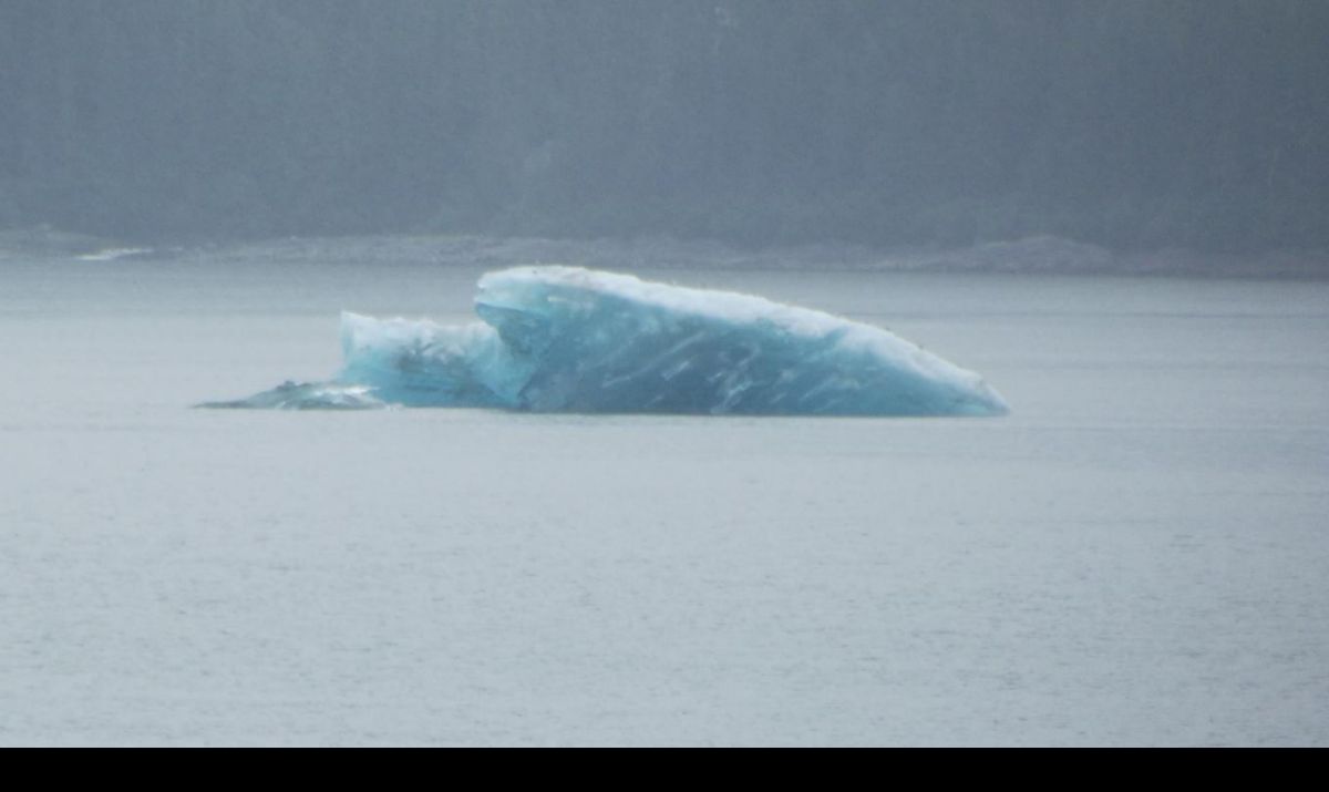 A very long shot of the iceberg.