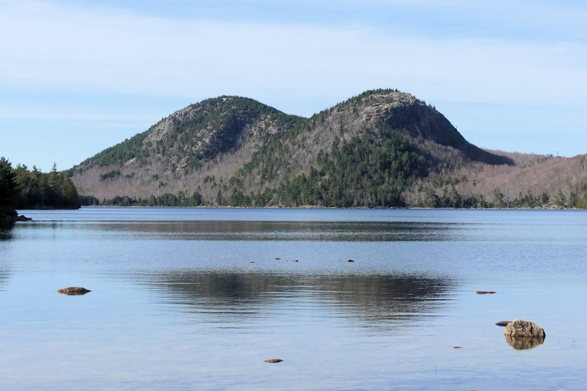 A closeup on the twin peaks known as The Bubbles, located at the far end of Jordan Pond.