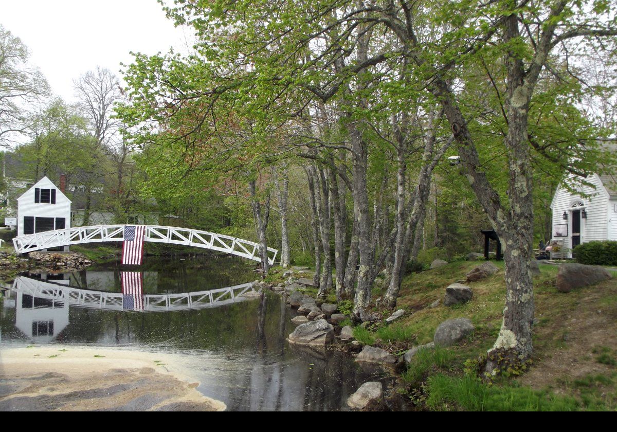 The Selectmen's Hut on the left, the Thaddeus Shepley Somes Memorial Bridge and the Somesville Museum just seen on the right that was constructed in 1981.