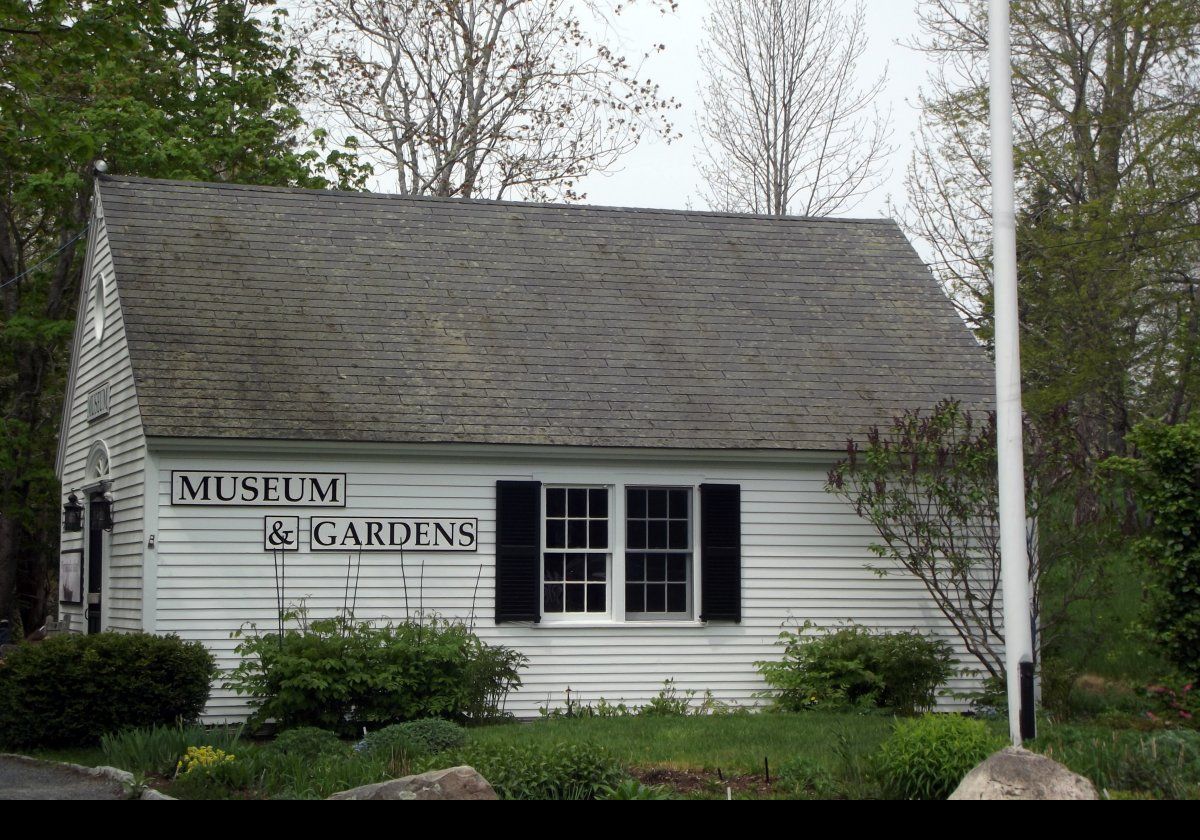 Constructed in 1981, Somesville Museum overlooks a mill pond, which is the outlet from Somes Pond, with Somes Harbor beyond.