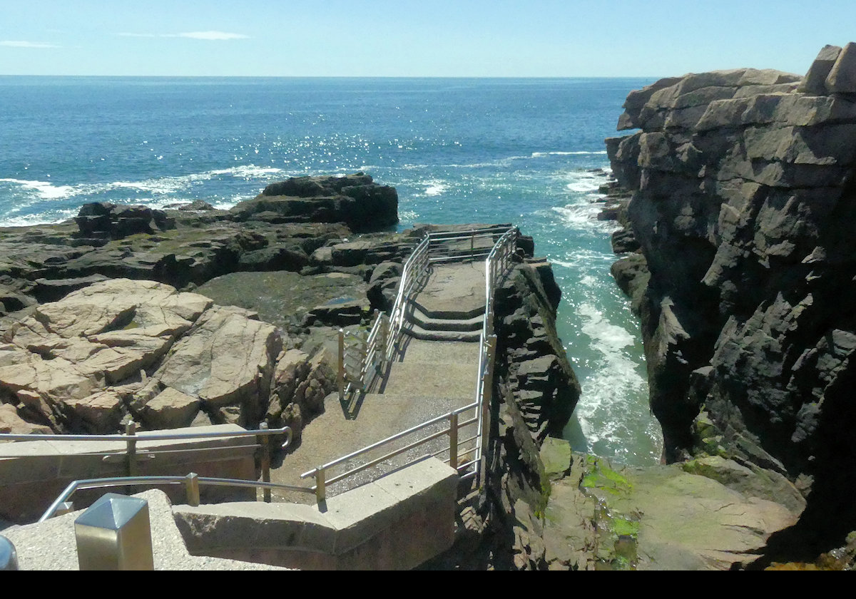 Thunder Hole is an inlet where there is a small cave just below the water line. When air gets into the cave before a large wave arrives, the air is forced out producing a thunderous roar. At least, that's the theory.