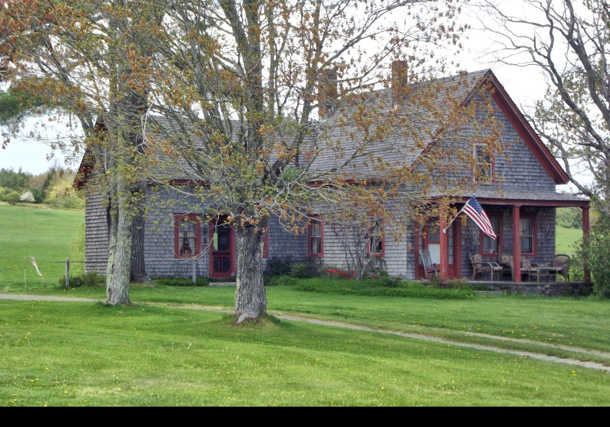 The wood framed, Greek Revival farm house and carriage barn were built somewhere between 1840 and 1860.