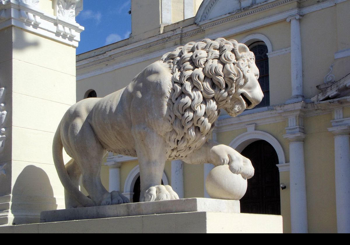 Statue of a lion at Jose Marti Plaza in Cienfuegos.  Copy of the Medici Lions.  Two versions outside the Cathedral de la Purisma Concepción in Cienfuegos (built 1833–69)