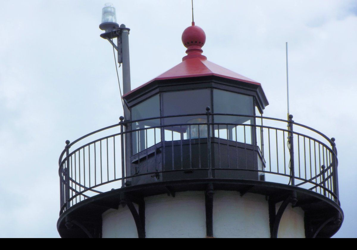 The current lighthouse tower was built In 1890 on the existing foundation of the 1848 tower that had been demolished. A covered walkway linked the tower to the Keeper's cottage. 1890 also saw construction of a new bell tower. This picture shows the modern optic now fitted to the lighthouse.