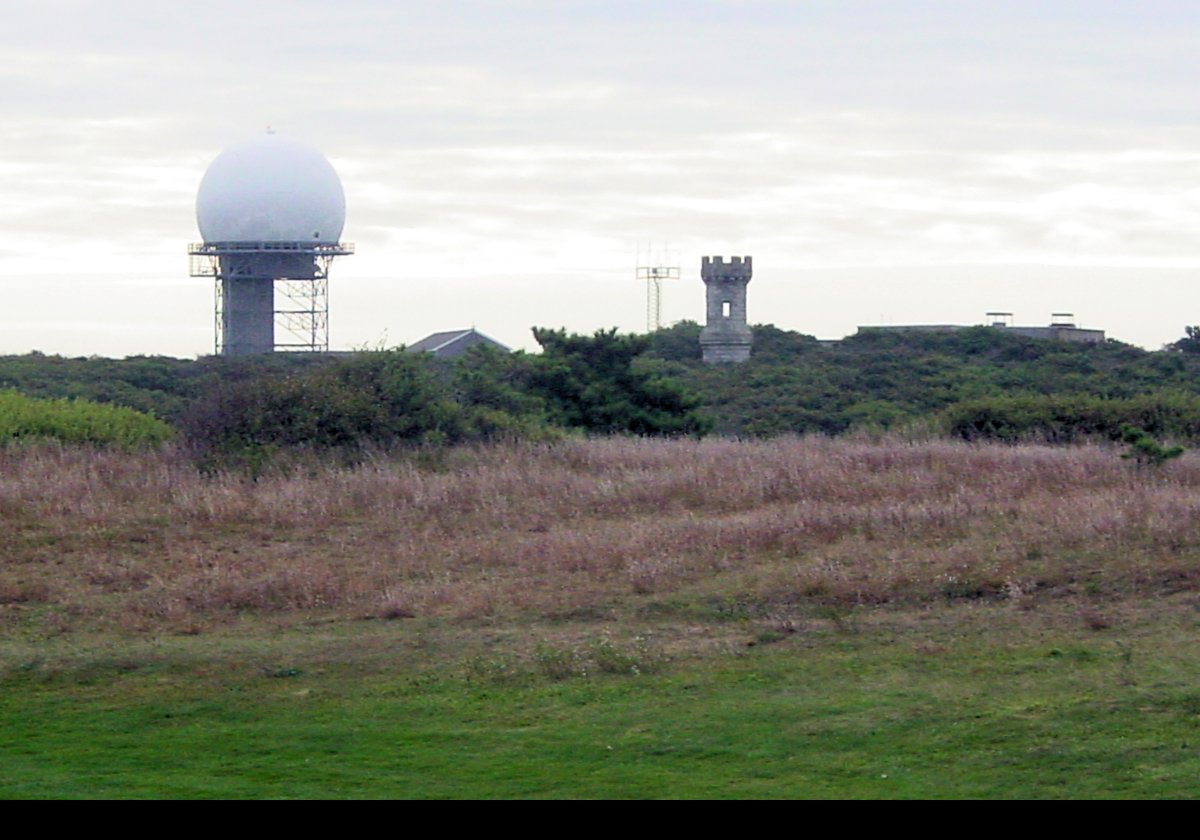 This is the Jenny Lind Tower that is visible from the lighthouse. Originally it was part of the Fitchburg Railway depot in Boston. A wealthy lawyer, and fan of Jenny Lind, Henry Aldrich moved it to the Cape Cod location in 1927 when the Fitchburg Railway depot was demolished.