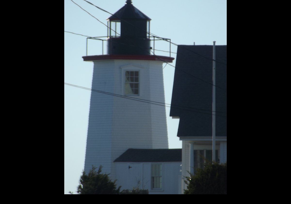 Located at the tip of Wings Neck Point in the town of Pocasset, it is built of wood on a fieldstone foundation.