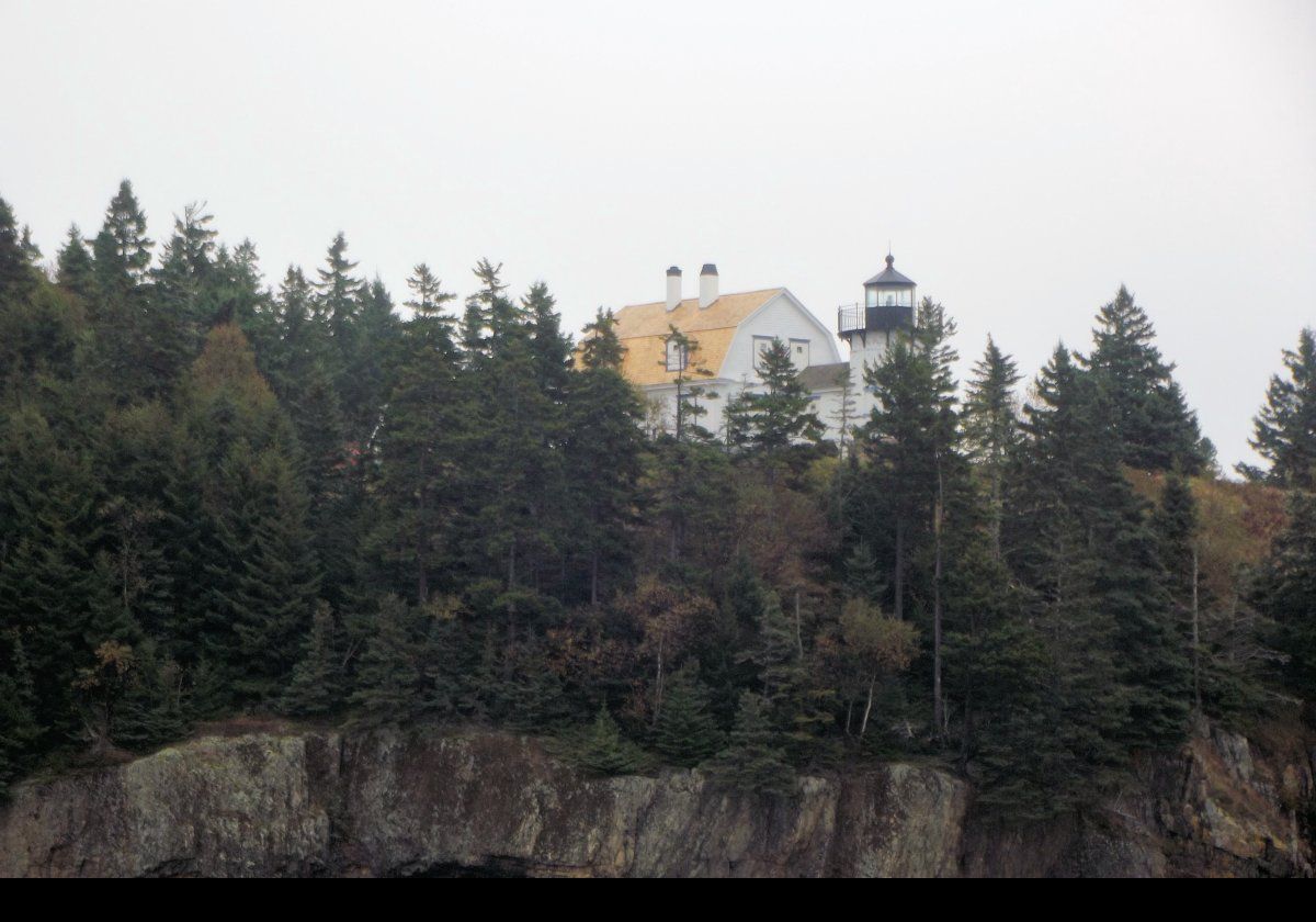 In 1888, the granite keeper’s house and all the other buildings, except the bell tower and some other new outbuildings, were demolished. By 1889 a new keepers house and light tower had been built and put into operation. This is the light station we see today.