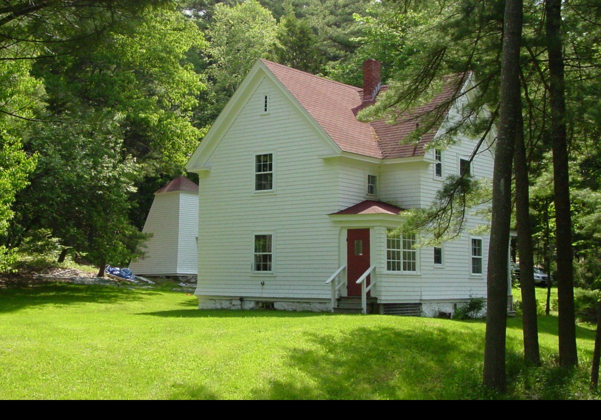 Note the old bell tower to the left of the cottage. The bell was moved into the lighthouse tower when it was moved offshore. The bell tower is now a garage.