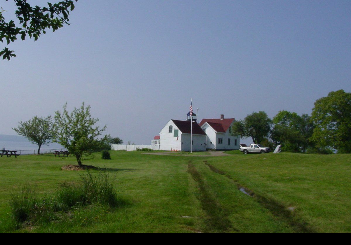 The first Fort Point Light was was a granite tower that was built in 1836. It was replaced in 1857 by the present brick lighthouse and a keeper's cottage. The lighthouse was fitted at that time with a Fourth-order Fresnel lens, that remains in use today.