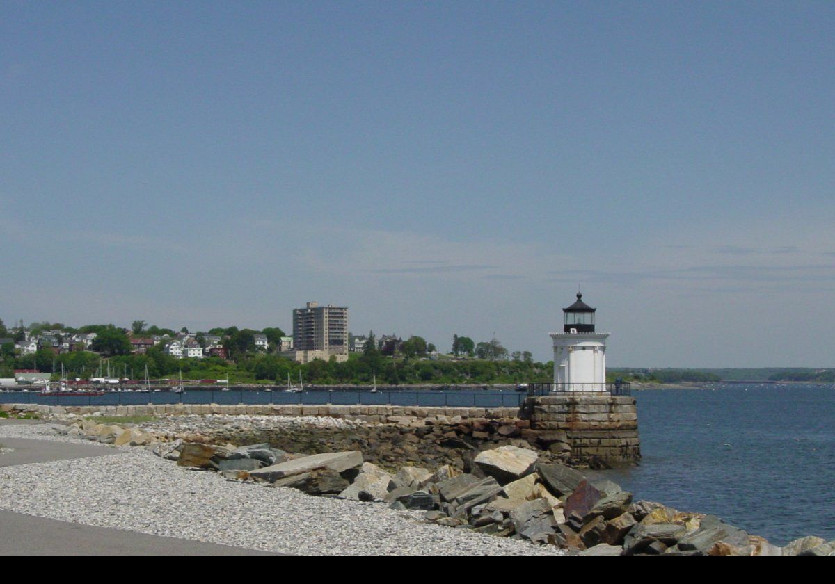 The Portland Breakwater Light. The first Portland Breakwater Lighthouse, a small wooden tower on the end of the 1,800 foot breakwater, went into service in 1855. The first light was a sixth-order (the lowest power) Fresnel lens with a fixed red light.