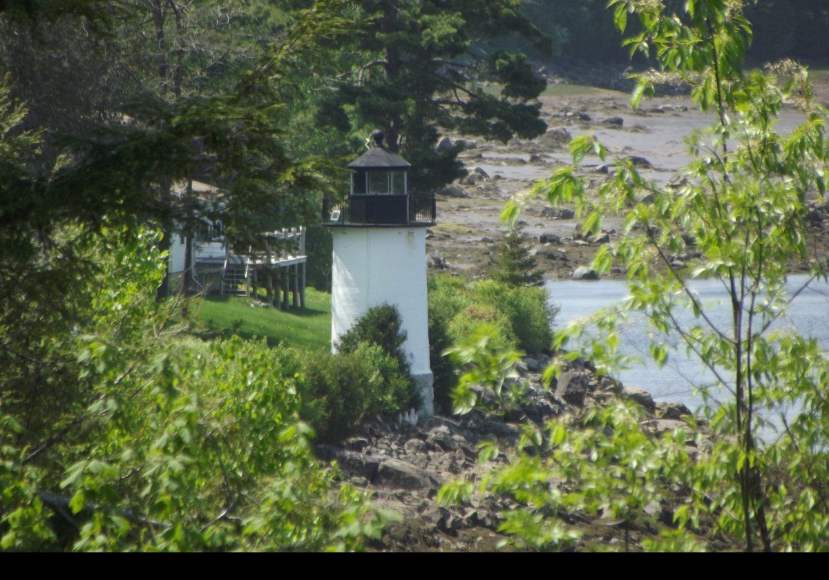 The lighthouse was automated in 1969 and the Fresnel lens replaced with a modern optic. In 2009, the optic was again replaced with an LED device. The house seen behind the lighthouse was the original keepers cottage. It is now in private hands together with other outbuildings, but not the tower.