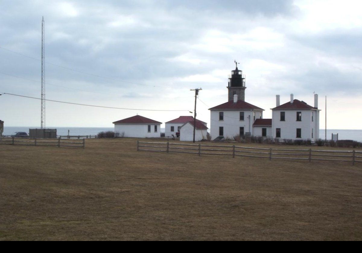 The first known light at Beavertail went into operation in 1712, maintained by local Native Americans.  A wooden tower was built in 1749, and the original foundation is still visible, as shown in one of the later photographs.  