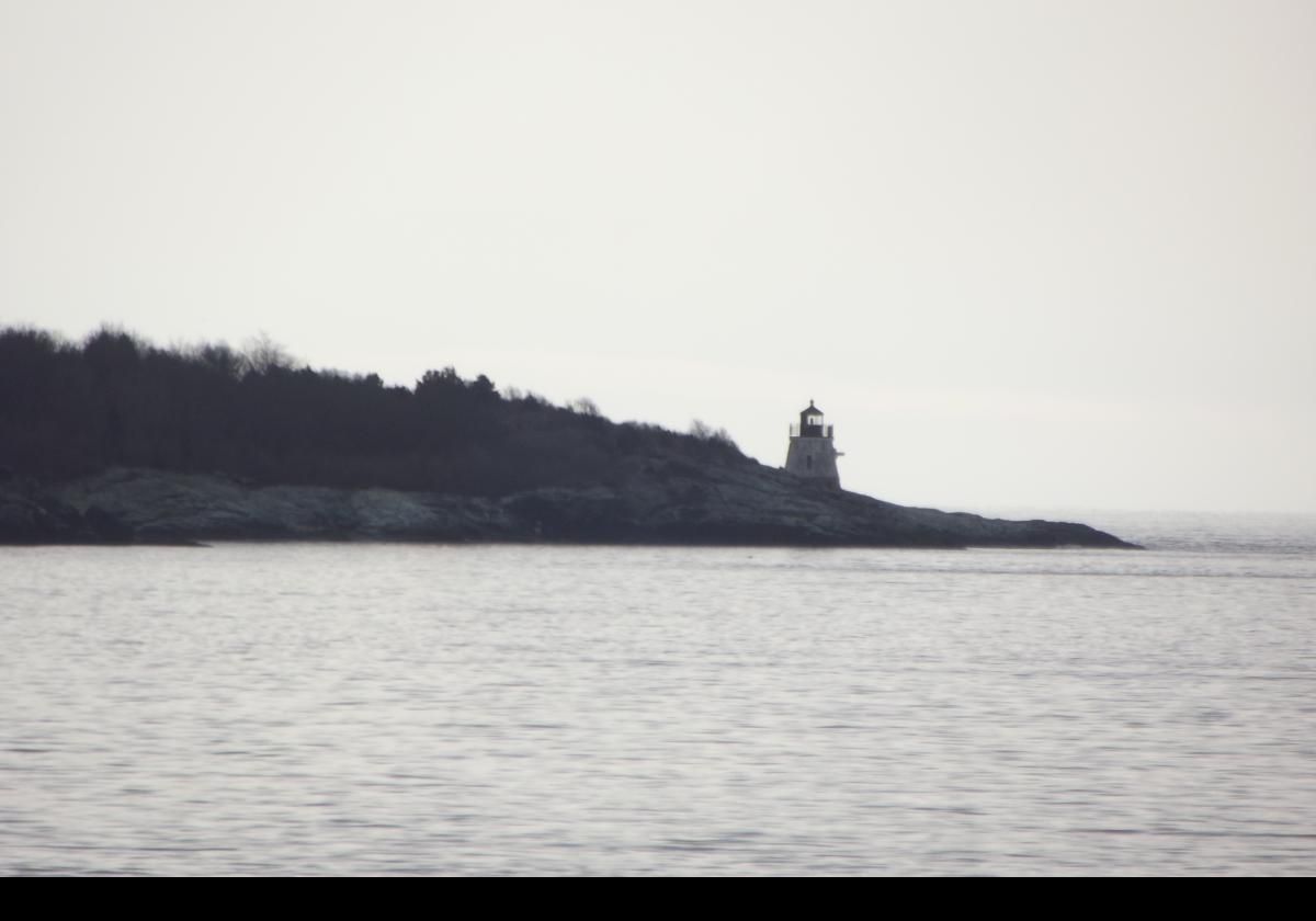 View of the lighthouse looking across Narragansett bay from Fort Wetherill on Conanicut Island; about 1.6 km (1 mile) away.  