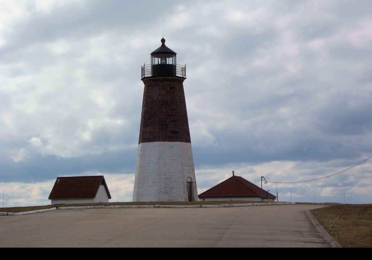 More changes occured in 1917 with construction of an oil house, and in 1923 when a new building was constructed to house the fog signal.  As you can see in the pictures, the brown paint has been stripped from the upper half of the tower leaving the natural brick color. This probably happened during the refurbishment in 2000.