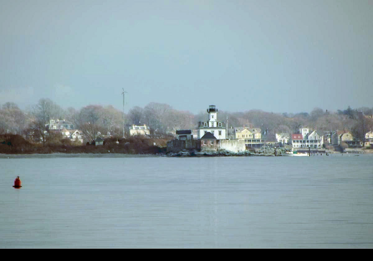 Built in 1870 on Rose Island in Narragansett Bay near the Newport Bridge between Newport and Jamestown. In the photograph it looks very close to the land behind it, but in fact it is located roughly centrally between Newport and Conanicut Island; about 1.6 km (one mile) from each!