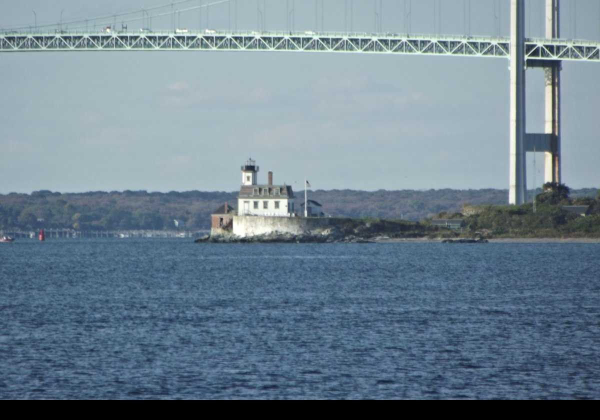 Looking north from Fort Adams Drive at the lighthouse with the Claiborne-Pell bridge in the background.