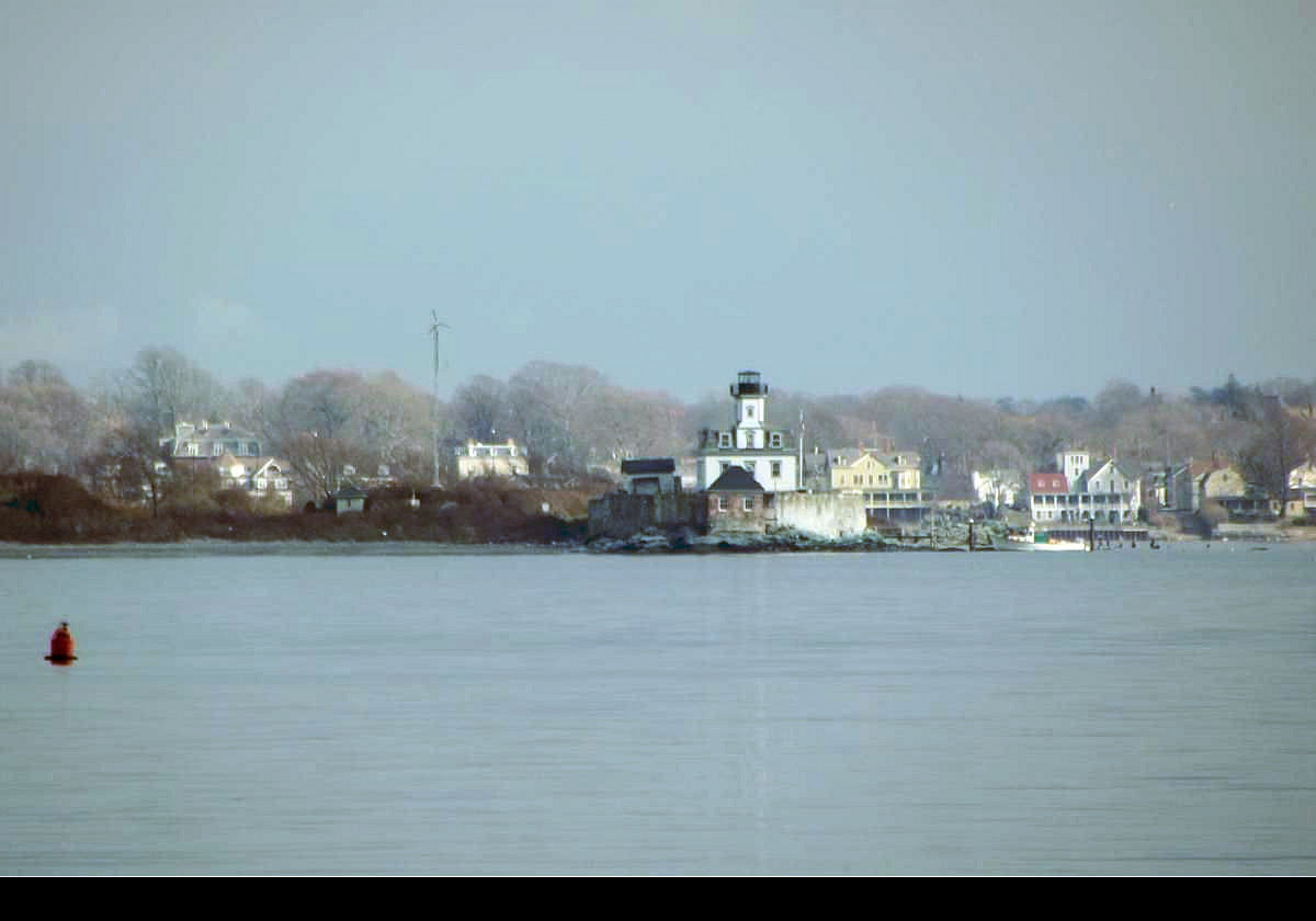 Built in 1870 on Rose Island in Narragansett Bay near the Newport Bridge between Newport and Jamestown.  In the photograph it looks very close to the land behind it, but in fact it is located roughly centrally between Newport and Conanicut Island; about 1.6 km (one mile) from each!