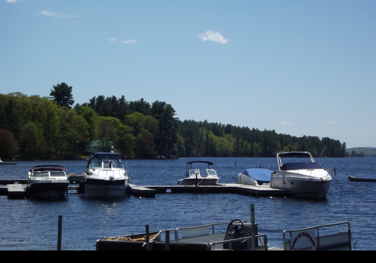 Harrison sits at  the northern end of Long Lake, and to the south of the much smaller Crystal Lake.