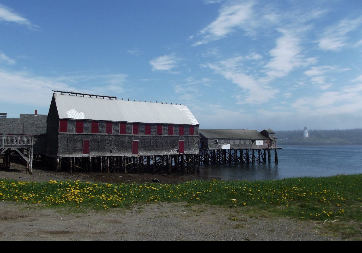 McCurdy’s Smokehouse with the Mulholland lighthouse just visible in the distance. Smoking herring had been a leading industry in Lubec for many years, and McCurdy's was the last to go out of business when it finally closed its doors in 1991. Now, there is a museum about the fishing industry in the skinning/packing shed, while Lubec Landmarks continues to restore the rest of the complex.