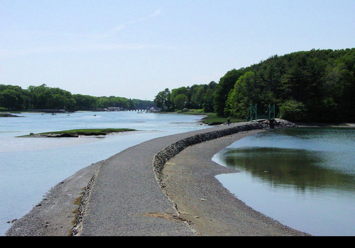 The pathway along the old dam that leads to the Wiggly Bridge.