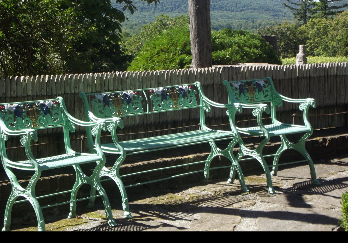 Wonderfully hand decorated benches in the afternoon garden.