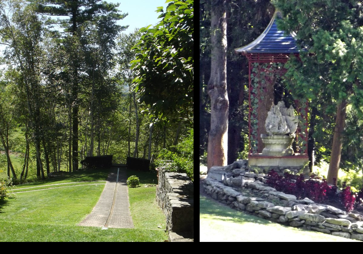 On the left, water trickles down the center of the channel towards the Blue Steps that start at the break in the hedge. On the right, one of the many statues.