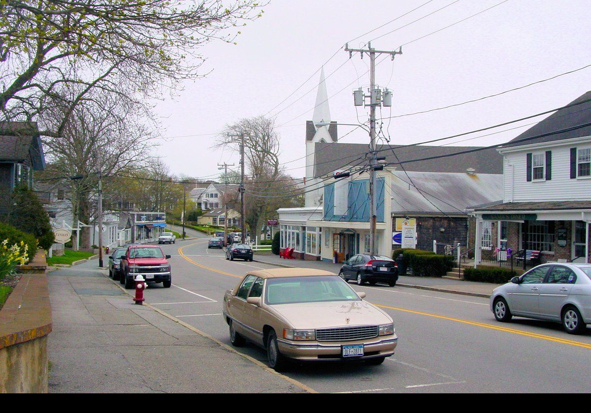 On one of our many trips to Cape Cod, we went with Deborah's mother.  We"wafted" down in her gold Cadillac, which is in the foreground of this picture.  This is the village of Chatham.