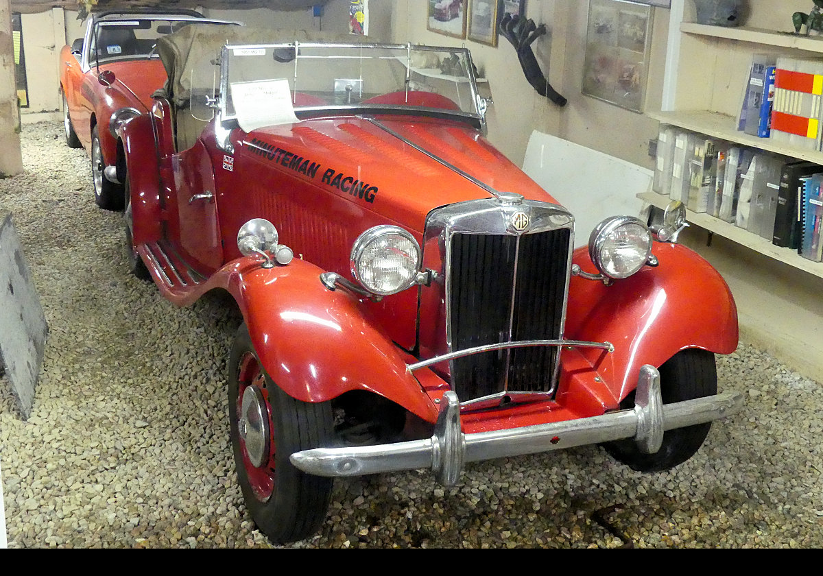 I believe this is an MG TD built between 1950 and 1953. Its 1250 cc engine gave it a top speed of 77 mph, and 0-60 acceleration in 18.2 seconds.  Not too shabby at the time!