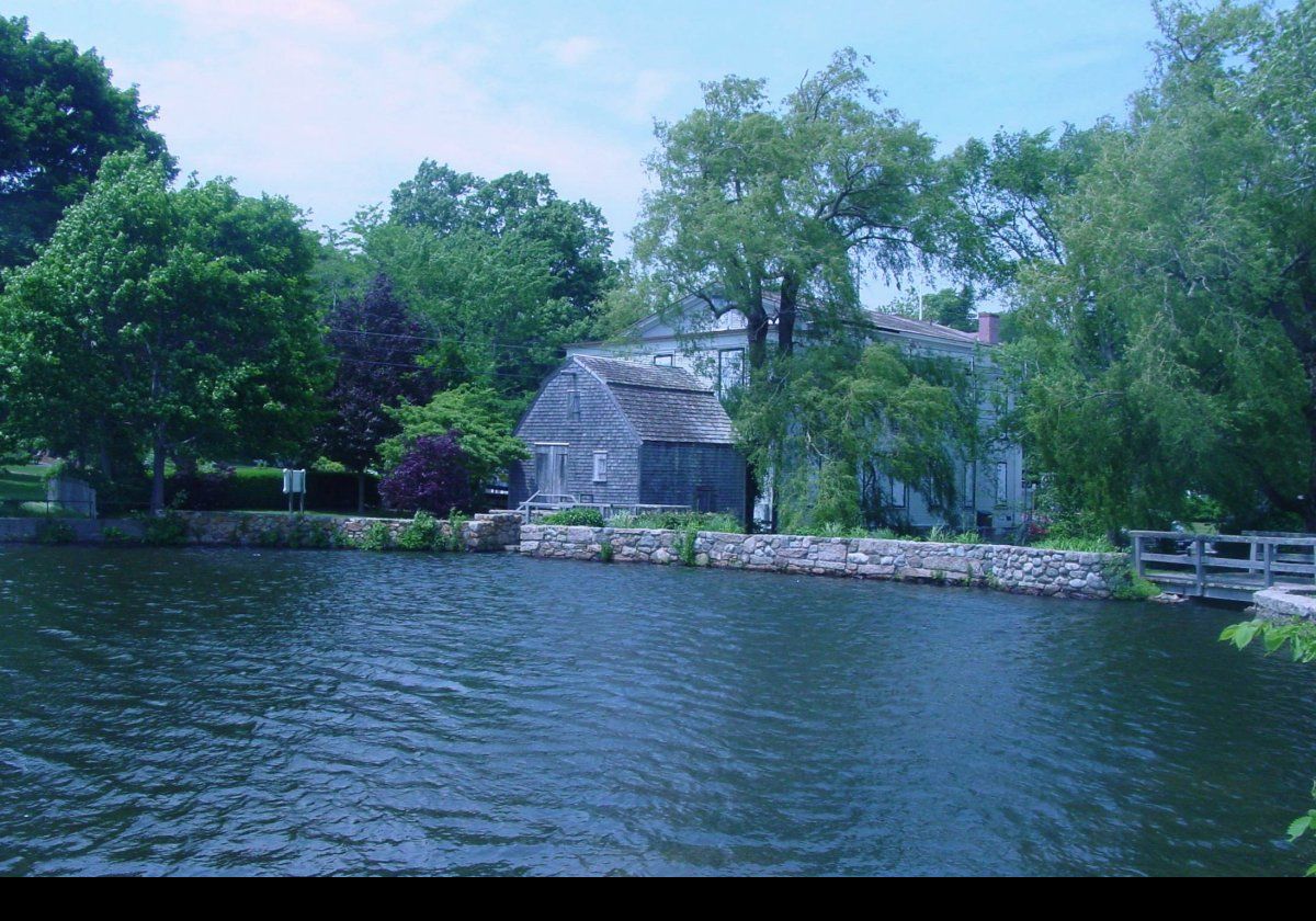 The mid-17th century Dexter Grist Mill on the edge of Shawme Lake in Sandwich, MA.  They do seasonal tours, and iIt is possible to mail order organic, stone ground cornmeal between mid-June & mid-October