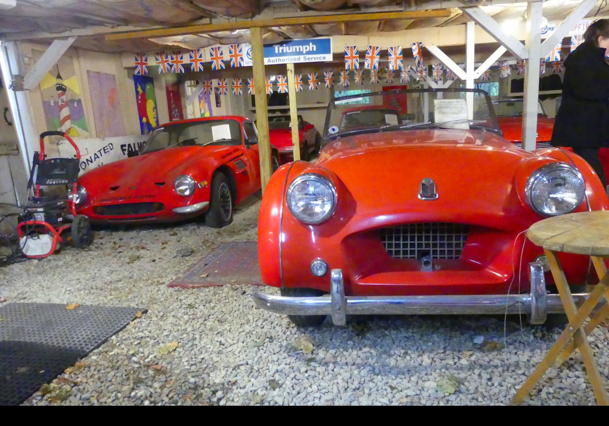 On the left is (I think) a TVR Vixen or Tuscan.  On the right, a Triumph TR2 made by the Standard Motor Company between 1953 and 1955.  
