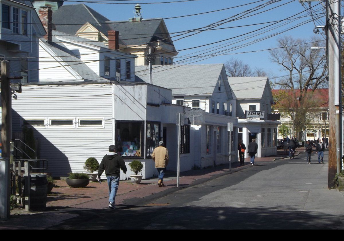 Commercial Street in Provincetown; looking towards Adam's Pharmacy.  This is a real old school pharmacy; you could almost believe you were back in the 1950s.