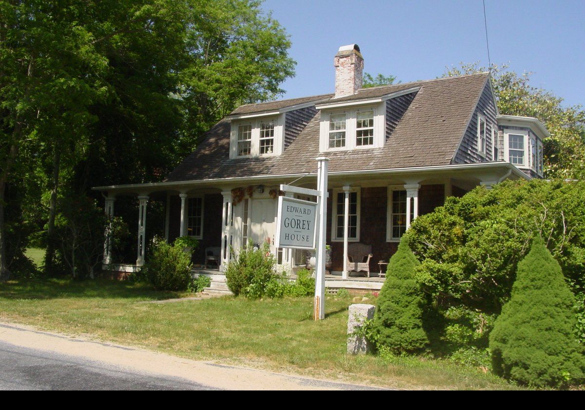 The Edward Gorey House.  Edward Gorey purchased this approximately 200 year old house in 1979.   It is located at 8 Strawberry Lane in Yarmouth Port in Cape Cod.  He lived there up until his death in 2000.  In 2002, the Highland Street Foundation purchased the house, after which it became a museum.  It is well worth a visit.  