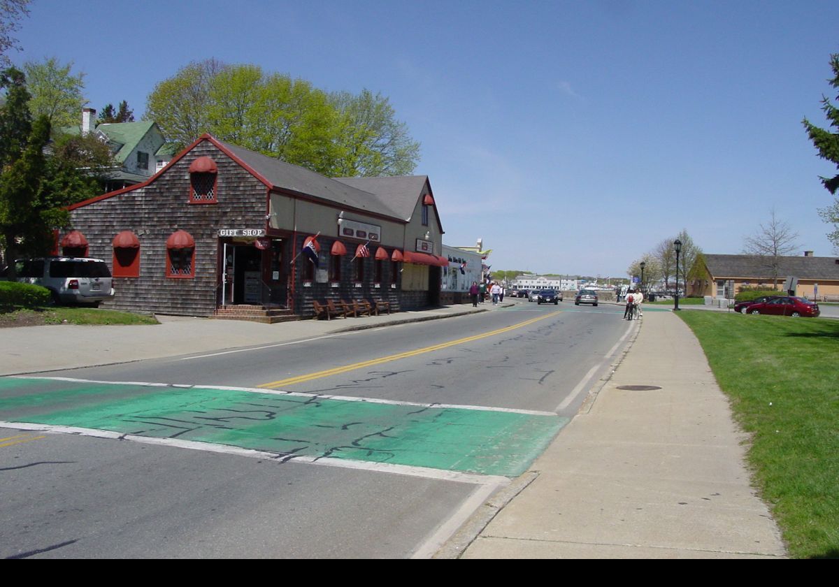 In Plymouth, MA, looking west along Water Street. The Gift Shop and Pillory Pub in front of us. To the right, out of camera, is the Pilgrim Memorial State Park, and behind us, the Plymouth Rock.