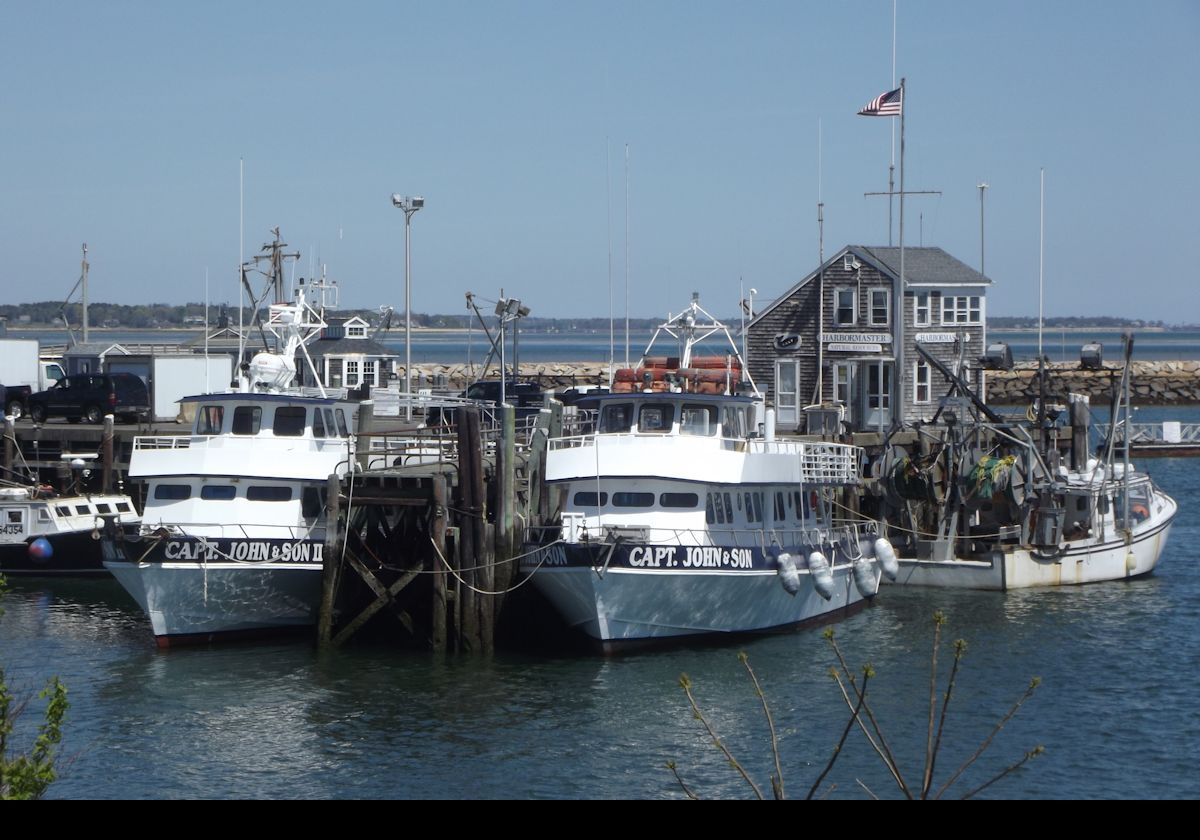 Capt John & Son run fishing tours out of Plymouth.  The eponymous boat was completed in 1977.  Behind is a closer view of the Harbor Master's Office.