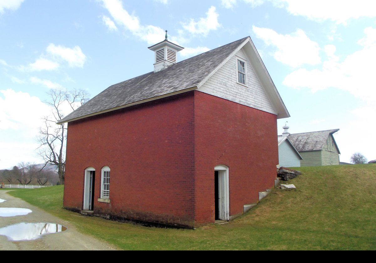 The rear of the Ice House. It faces north to keep it in shadow. The windows are all triple glazed, and double doors act like an air lock.