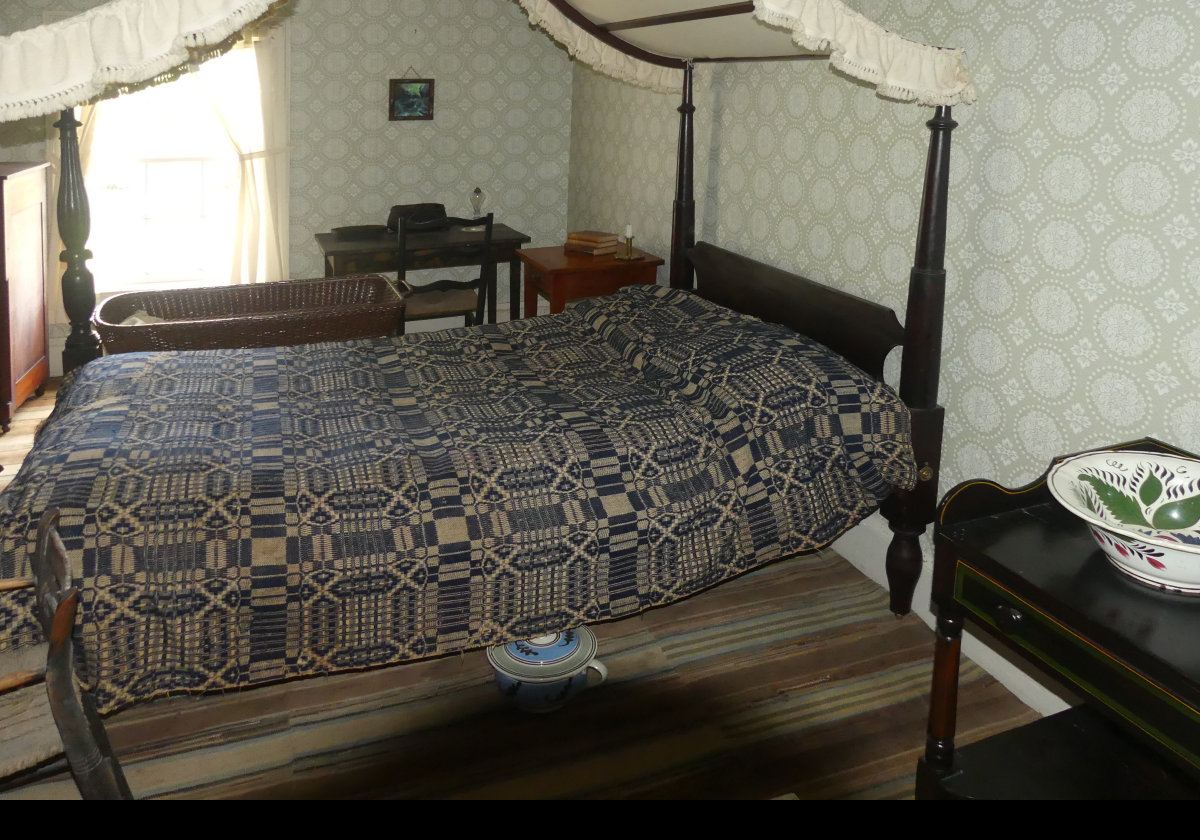 Another bedroom with a glimpse of the inevitable chamber pot.