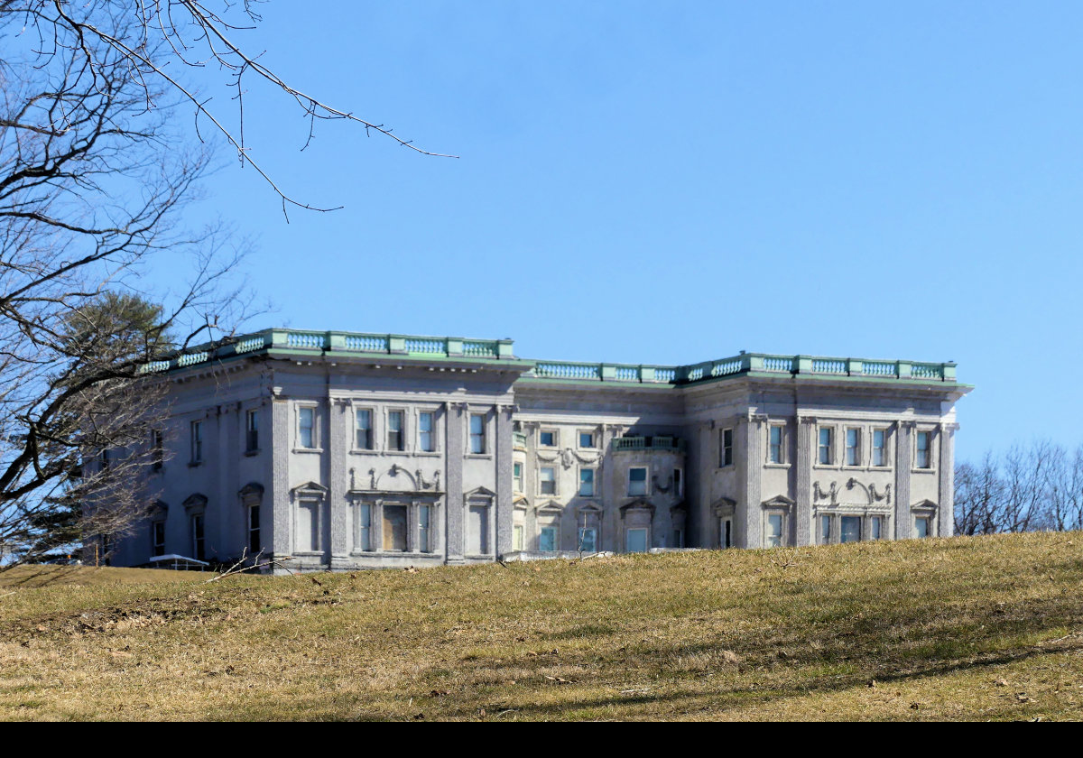 In 1832, Morgan Lewis and his wife, Gertrude Livingston, built a house on the site to replace an earlier house that had been destroyed by fire. It was a "modest" 25 room mansion in the Greek Revival style.