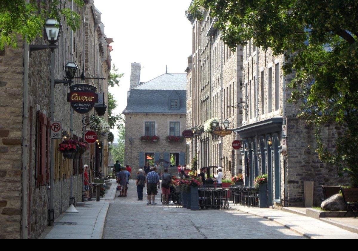 To the right, L'Oncle Antoine restaurant, to the left, Le Voutes du Cavour on Rue Saint Pierre.
