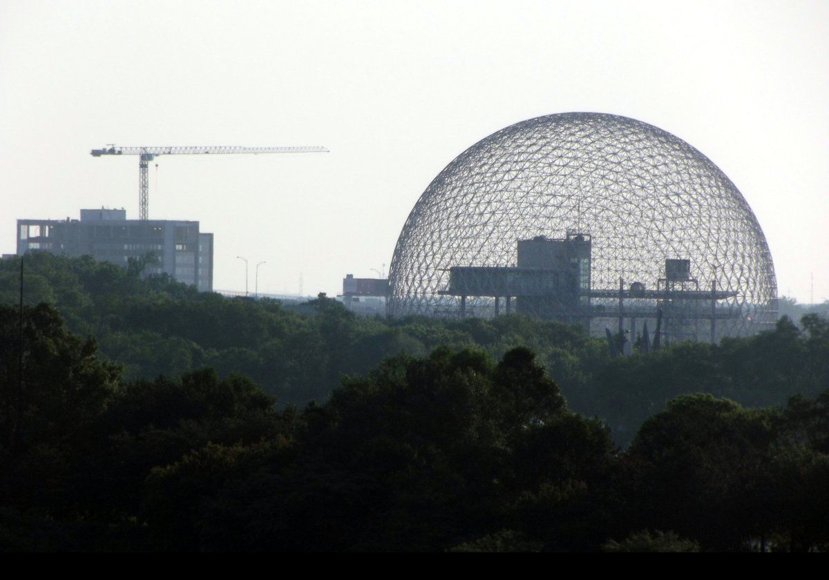The Biosphere in Parc Jean-Drapeau, on Saint Helen's Island.  Designed by Buckminster Fuller, the dome is 76 metres (250 ft) in diameter & 62 metres (200 ft) high.  The original transparent acrylic cover burned in a fire in May 1976.  The curren museum coprises a series of buildings within the original steel skeleton.