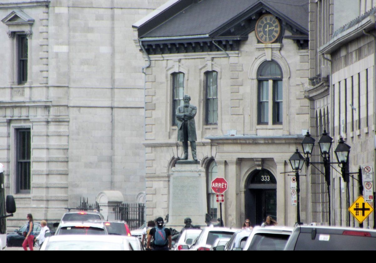 The statue of John Young, by sculptor Louis-Philippe Hébert, originally stood in front of the old port where it was unveiled in 1911; the 100th anniversary of Young's birth.  In 1997, it was moved to its current location in front of the Allan Building.