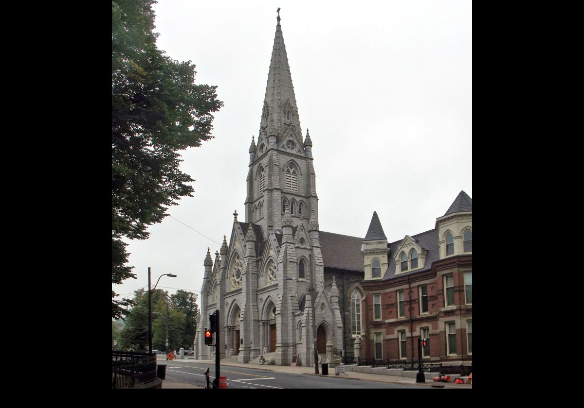 St. Mary's Cathedral. It is the largest Catholic church in the Archdiocese of Halifax, NS, and has the tallest granite spire in North America. Pope Pius XII made it a basilica in 1950. A corner of Glebe House can be seen on the right.