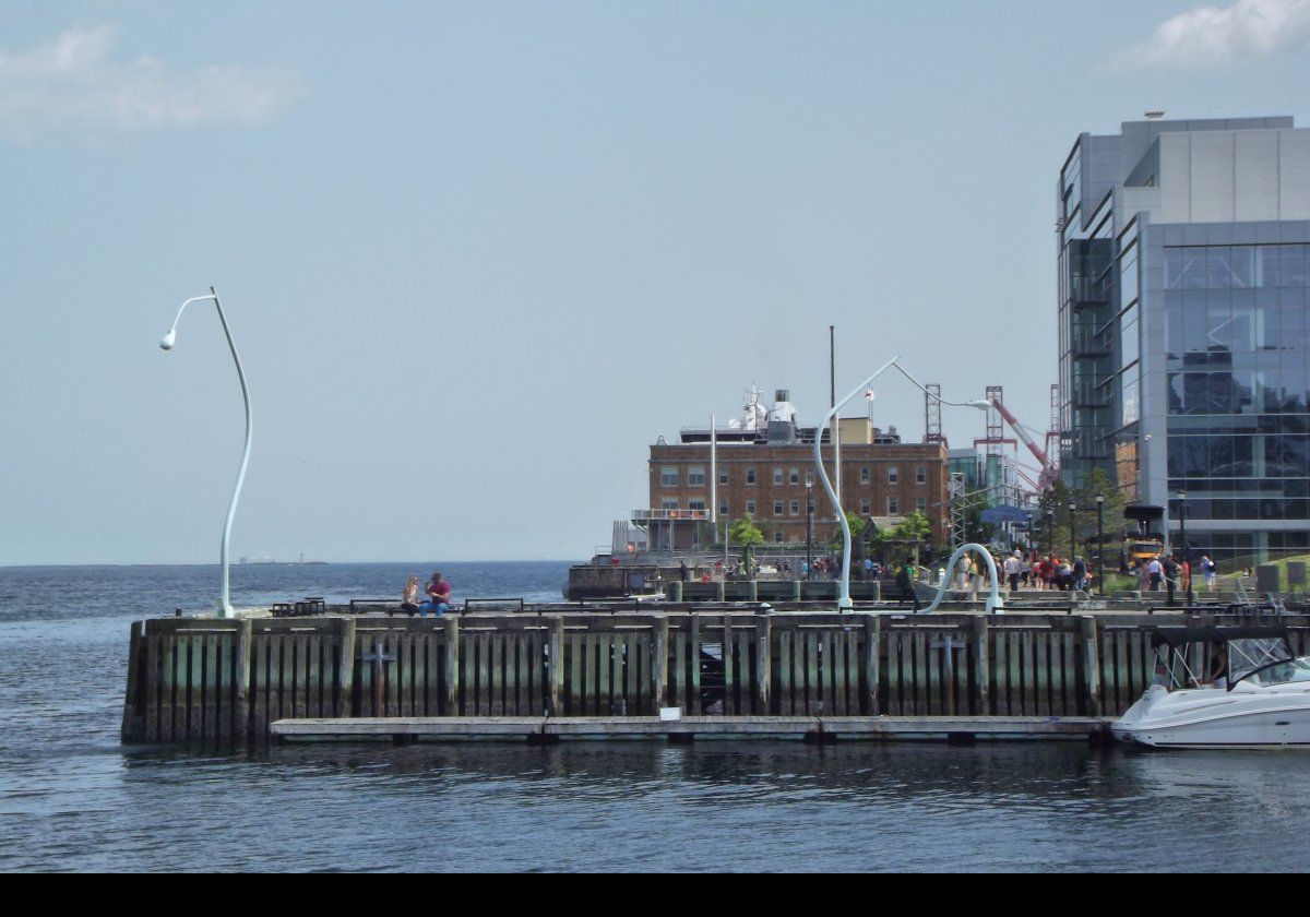 Looking south back towards South Battery Pier. The drunken lampposts called "Fountain" & "Got Drunk, Fell Down". Fountain shoots water into the harbour, while Get Drunk, Fall Down is a collapsed lampost.