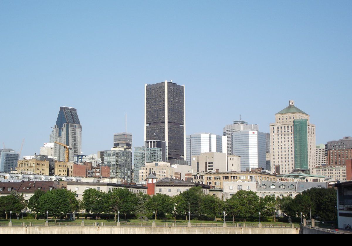 Left skyscraper: 1000 de la Gauchetière.  Built in 1992, it is the tallest building in Montreal at 205 meters (673 ft) with 51 floors.  Centre: The Stock Exchange Tower built in 1964.