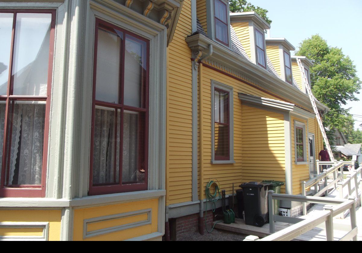 The rear of the house getting a little maintenance.  The exterior is beautifully kept.