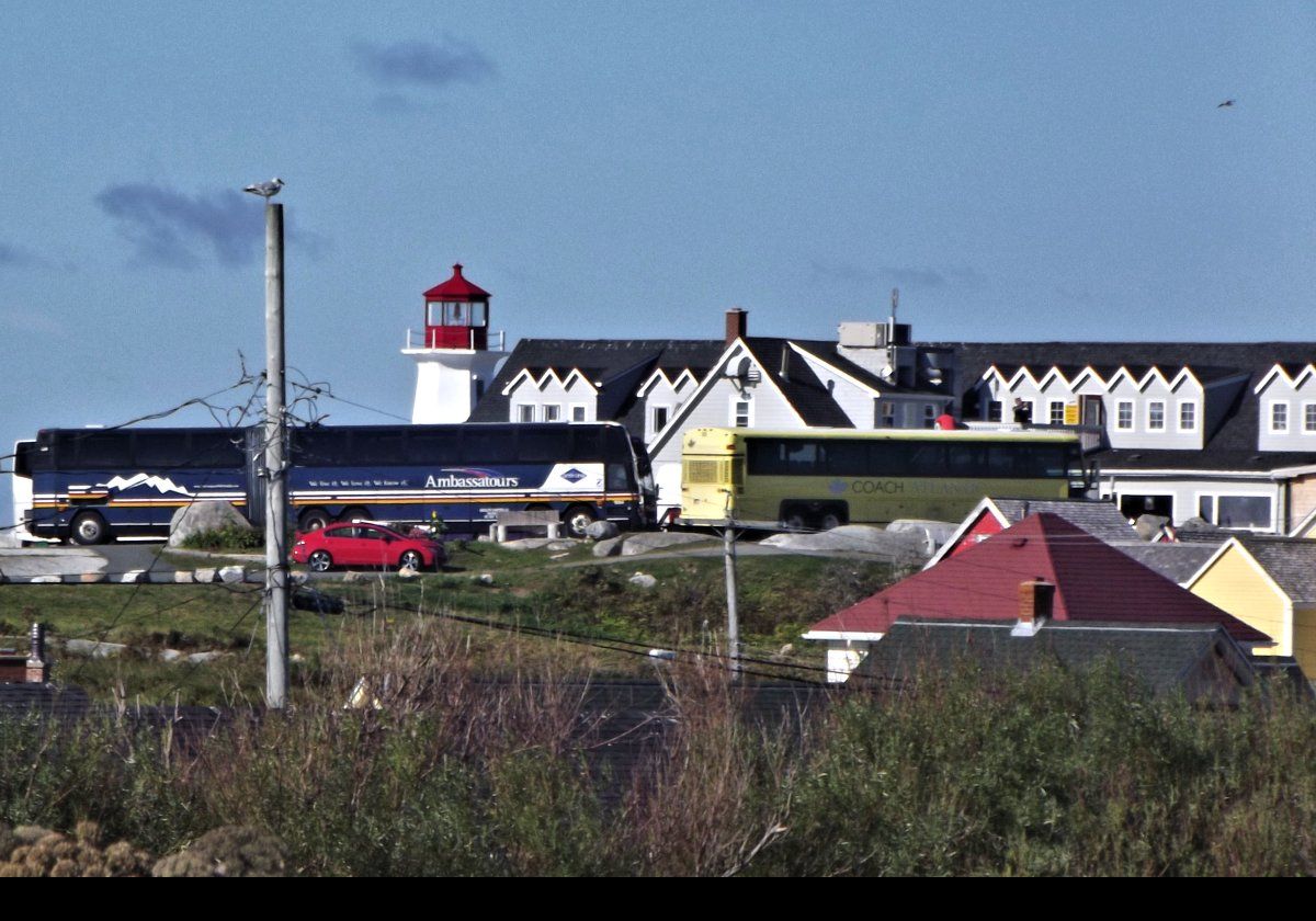 A first glimpse of Peggy's Cove Lighthouse viewed from the car park near the Visitor Information Centre.